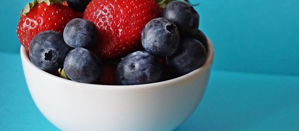 blueberries-and-strawberries-in-white-ceramic-bowl-1120575